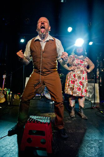 Captain Stab-Tuggp (left) lifts an iron attached to his tongue as he performs on stage with his partner Maybelle during the 4th annual Battle of the Beards at Smith's Olde Bar in Atlanta on Saturday, December 13, 2014.