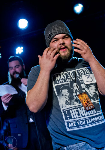 Josh Parvin (right) plays up to the crowd in the Best Grooming competition as Mike Albanese emcees during the 4th annual Battle of the Beards at Smith's Olde Bar in Atlanta on Saturday, December 13, 2014. 