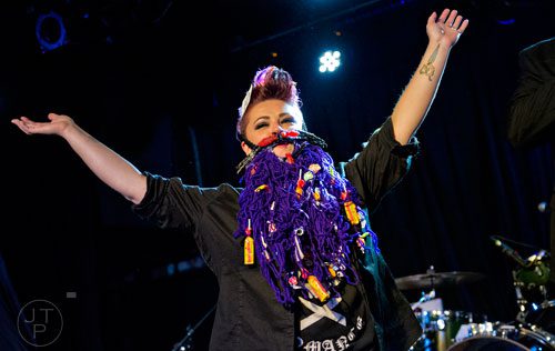 Melodi Latta plays to the crowd as she competes in the Lady Beard competition during the 4th annual Battle of the Beards at Smith's Olde Bar in Atlanta on Saturday, December 13, 2014.