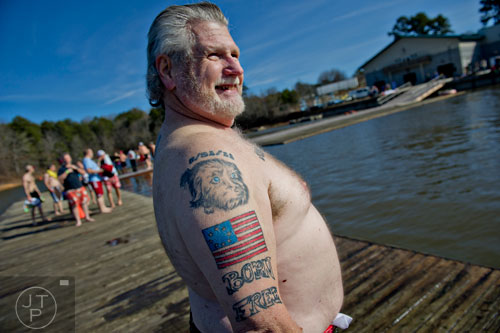Jim Henson prepares to jump into Lake Lanier during the 18th annual Polar Bear Plunge at the Lanier Canoe & Kayak Club in Gainesville on Thursday, January 1, 2015. 
