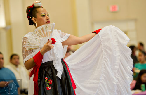 Dora Lopez dances as she performs during the Three Kings Day Festival at the Atlanta History Center on Sunday, January 4, 2015. 