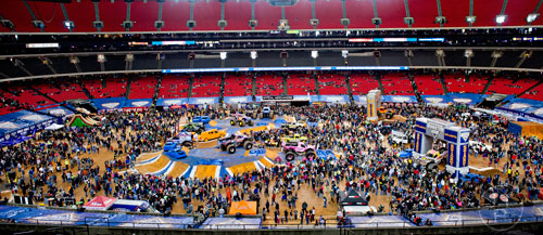 Thousands of people check out the 16 monster trucks on display during the pit party before the start of Monster Jam at the Georgia Dome in Atlanta on Saturday, January 10, 2015. 