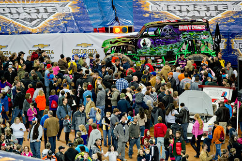 Thousands of people check out Grave Digger and the 15 other monster trucks  during the pit party before the start of Monster Jam at the Georgia Dome in Atlanta on Saturday, January 10, 2015.