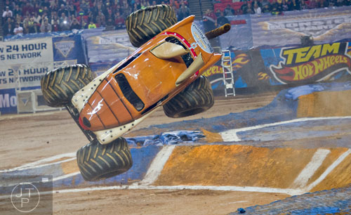 Monster Mutt flies through the air sideways during Monster Jam at the Georgia Dome in Atlanta on Saturday, January 10, 2015. 