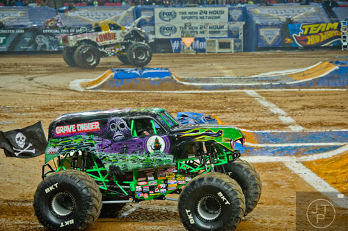 Grave Digger races against Zombie during Monster Jam at the Georgia Dome in Atlanta on Saturday, January 10, 2015. 