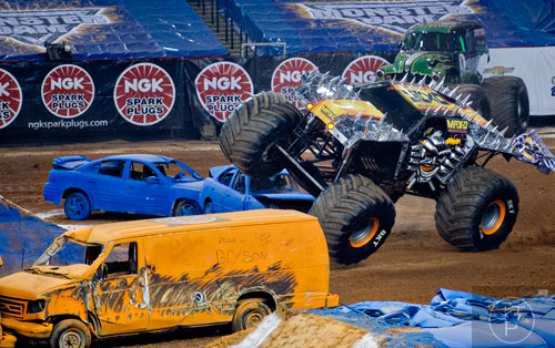 Max-D tips after taking a turn too sharply during Monster Jam at the Georgia Dome in Atlanta on Saturday, January 10, 2015. 