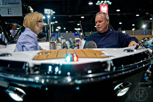 Debbie Salsman (left) and her husband Larry sit in the bow of a Monterey 244fs during the Atlanta Boat Show at the Georgia World Congress Center on Saturday, January 17, 2015. 