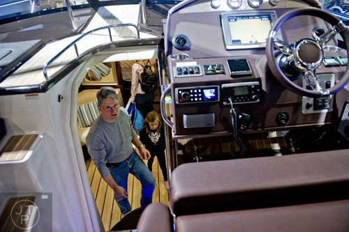 Don Scott and his daughter Kristen check out the cabin of a Regal 46 foot Sport Coupe during the Atlanta Boat Show at the Georgia World Congress Center on Saturday, January 17, 2015. 