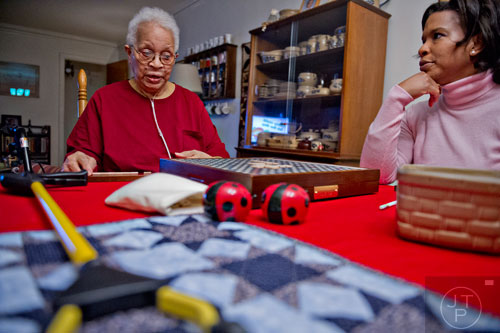 Ann Drake (left) plays a game of scrabble with her daughter Crystal at her home in Atlanta on Wednesday, January 14, 2015. 