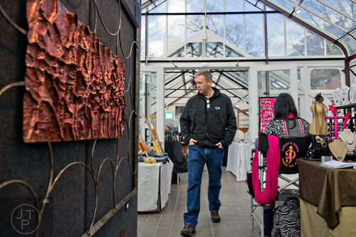 John Day looks at different artwork on display during the Callanwolde Arts Festival in Atlanta on Saturday, January 24, 2015. 