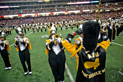 Jaelon Leonard (center) plays his trumpet with the rest of the Alabama State University marching band during the Honda Battle of the Bands at the Georgia Done in Atlanta on Saturday, January 24, 2015.