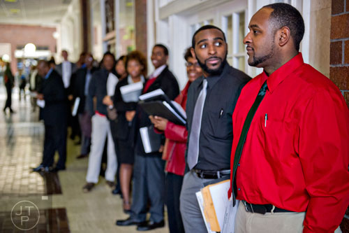 Khary Sylva (right) and Nkosi Kalonji stands in line as they wait for the start of the 69th Atlanta Diversity, Professional, Veteran, Collegiate Career Fair at the Cobb Galleria Centre in Atlanta on Thursday, January 29, 2015. 