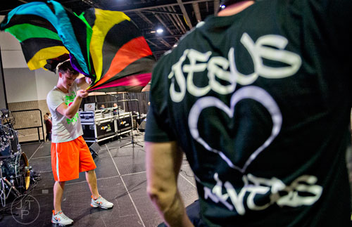 Aaron Stearns (left) dances on stage as D.J. Goshen Sai performs during Jam Zone at the Georgia World Congress Center in Atlanta on Saturday, February 7, 2015. 