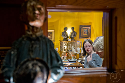 Virginia Echols (left) and her mother Caroline look at different antiques during the Cathedral Antiques Show at the Cathedral of St. Philip in Atlanta on Saturday, February 7, 2015. 