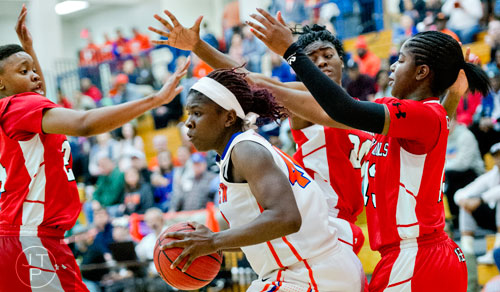 Parkview's Victoria Harris (center) is surrounded by the Osborne defense as she drives towards the basket during the third round of the girls state basketball championship on Tuesday, February 24, 2015.