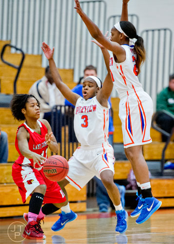 Parkview's Dominque Leonidas (3) and Makenna Pouengue double team Osborne's A'stavea McCowann (left) during the third round of the girls state basketball championship on Tuesday, February 24, 2015. 