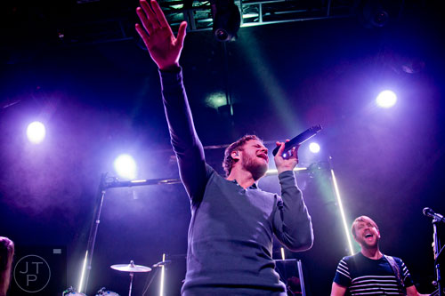 Imagine Dragons' Dan Reynolds (center) and Ben McKee perform on stage at Terminal West in Atlanta to a sold out show on Wednesday, February 25, 2015.  