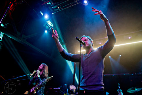 Imagine Dragons' Dan Reynolds (center) and Wayne Sermon perform on stage at Terminal West in Atlanta to a sold out show on Wednesday, February 25, 2015. 