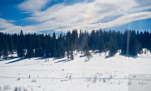 Nordic skiers run the cross country trail in Breckenridge, Colorado.