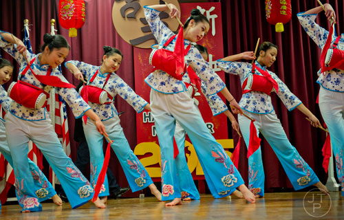Yannie Tan (center) and other members of the Atlanta Chinese Dance Company perform on stage during the Chinese Lunar New Year celebration in Chamblee on Saturday, February 21, 2015. 