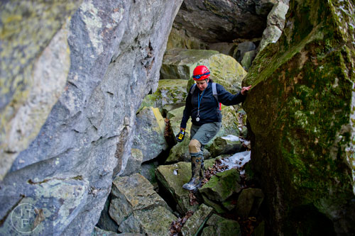 Nikki Castleberry works her way down to the entrance of Frick's Cave in Chickamauga, Ga. during the Southeastern Cave Conservancy Inc.'s open house on Saturday, February 28, 2015. 