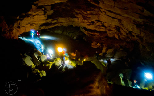 Cavers make their way through the inside of Frick's Cave in Chickamauga, Ga. during the Southeastern Cave Conservancy Inc.'s open house on Saturday, February 28, 2015. 