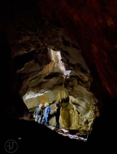 Gavin Warren (left) and Brad Barker make their way through Frick's Cave in Chickamauga, Ga. during the Southeastern Cave Conservancy Inc.'s open house on Saturday, February 28, 2015. 