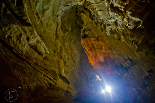 Cavers make their way past rock formations inside Frick's Cave in Chickamauga, Ga. during the Southeastern Cave Conservancy Inc.'s open house on Saturday, February 28, 2015. 