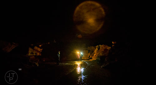Cavers make their way through the water inside Frick's Cave in Chickamauga, Ga. during the Southeastern Cave Conservancy Inc.'s open house on Saturday, February 28, 2015. 