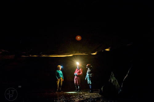 Nancy Brown (left), Doug Carson and Janice "J.J." Broome take a moment to talk inside Frick's Cave in Chickamauga, Ga. during the Southeastern Cave Conservancy Inc.'s open house on Saturday, February 28, 2015. 