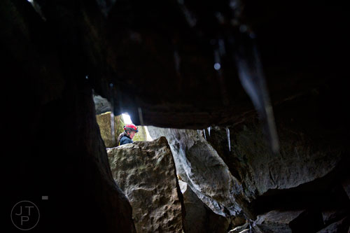 Janice "J.J." Broome makes her way out of the mouth of Frick's Cave in Chickamauga, Ga. during the Southeastern Cave Conservancy Inc.'s open house on Saturday, February 28, 2015.