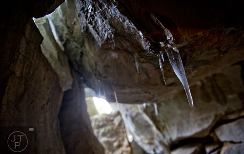 Ice hangs from the rocks at the mouth of Frick's Cave in Chickamauga, Ga. during the Southeastern Cave Conservancy Inc.'s open house on Saturday, February 28, 2015. 