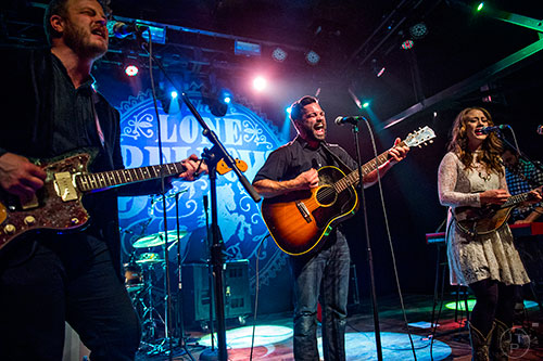 Brian Elmquist (left), Zach Williams and Kanene Donehey Pipkin of the band The Lone Bellow perform on stage at Terminal West in Atlanta on Wednesday, March 11, 2015.  