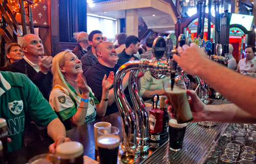 Lisa Lynch (left) reacts to the third round of the Six Nations rugby tournament as Ireland matched up against England at Fado's Irish Pub in Buckhead on Sunday, March 1, 2015. 