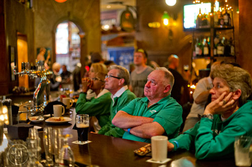 Derek Dobbs (center) sits at the bar at Fado's Irish Pub in Buckhead on Sunday, March 1, 2015.