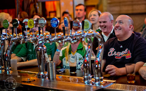 Lance Sapp (right) drinks his beer at the bar at Fado's Irish Pub in Buckhead on Sunday, March 1, 2015.