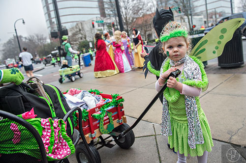 Bailey McDuff (right) pulls a wagon as she waits for the start of the 2015 Atlanta St. Patrick's Parade on Saturday, March 14, 2015. 