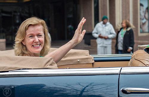 Anne Anderson, Irish Ambassador to the United States, waves to the crowd during the 2015 Atlanta St. Patrick's Parade on Saturday, March 14, 2015. 