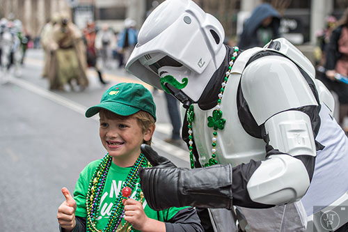 Dressed as a scout trooper from Star Wars, Shane Duncan (right) poses for a photo with Tate Adams during the 2015 Atlanta St. Patrick's Parade on Saturday, March 14, 2015. 