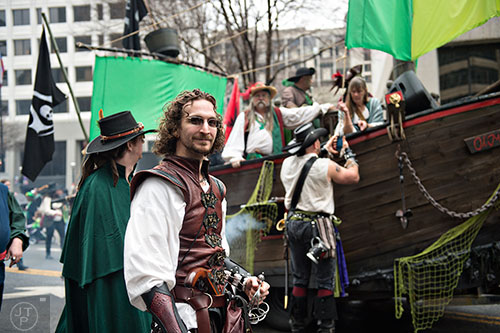 Dressed as a pirate, Eric Teeples (center) makes his way down Peachtree St. during the 2015 Atlanta St. Patrick's Parade on Saturday, March 14, 2015. 