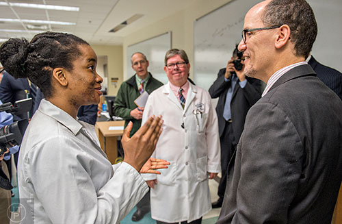 U.S. Secretary of Labor Thomas Perez (right) speaks with Pamela Uwechue during a tour of Gwinnett Technical College in Lawrenceville on Friday, March 20, 2015. 