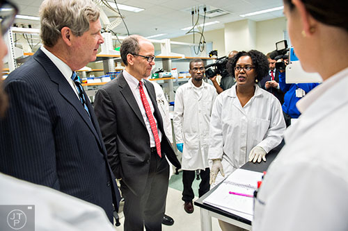 U.S. Secretary of Agriculture Tom Vilsack (left) and Secretary of Labor Thomas Perez speak with Yolanda Hale during a tour of Gwinnett Technical College in Lawrenceville on Friday, March 20, 2015. 
