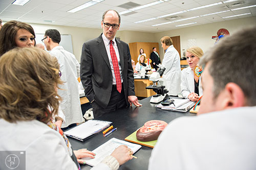 U.S. Secretary of Labor Thomas Perez (center) speaks with students during a tour of Gwinnett Technical College in Lawrenceville on Friday, March 20, 2015. 
