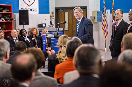 U.S. Secretary of Agriculture Tom Vilsack (left) and Secretary of Labor Thomas Perez speak at Gwinnett Technical College in Lawrenceville on Friday, March 20, 2015. 