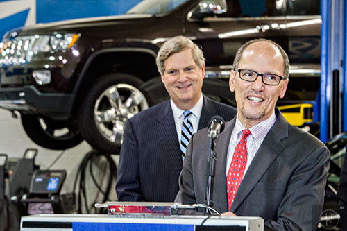 U.S. Secretary of Labor Thomas Perez (right) and Secretary of Agriculture Tom Vilsack speak at Gwinnett Technical College in Lawrenceville on Friday, March 20, 2015. 