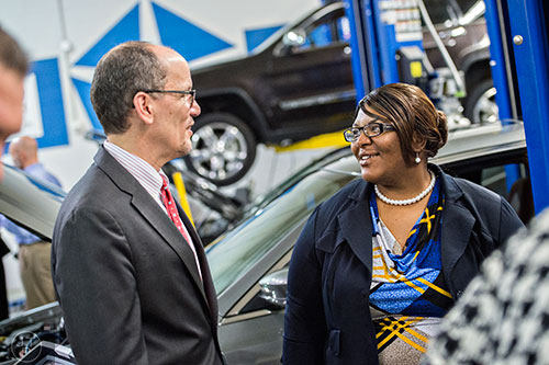 Danina Battle (right) speaks with U.S. Secretary of Labor Thomas Perez after his press conference with Secretary of Agriculture Tom Vilsack at Gwinnett Technical College in Lawrenceville on Friday, March 20, 2015.  Secretaries Perez and Vilsack announced that Georgia would be one of 10 states receiving $15 million for a program to provide education and training to help food stamp recipients transition from government assistance to the work world. Battle had been a participant in the Supplemental Nutrition Assistance Program until recently graduating from the college. 