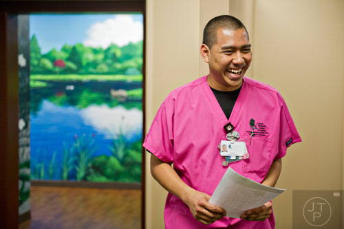 Tony Phommasack leads the daily alignment meeting with the radiation therapy staff at the Cancer Treatment Centers of America's Southeastern Regional Medical Center in Newnan on Friday, February 20, 2015.  