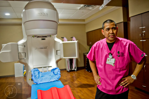 Tony Phommasack talks about radiation therapy at the Cancer Treatment Centers of America's Southeastern Regional Medical Center in Newnan on Friday, February 20, 2015. 