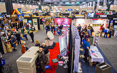 Attendees walk past well over 300 exhibitors during the 37th annual Spring Atlanta Home Show at the Cobb Galleria Centre in Atlanta on Sunday, March 22, 2015.