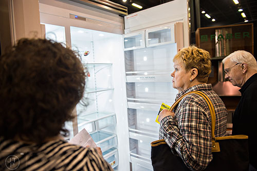 Brenda Driver (center) and her husband Brandy Davenport check out the inside of a Viking refrigerator display during the 37th annual Spring Atlanta Home Show at the Cobb Galleria Centre in Atlanta on Sunday, March 22, 2015. 